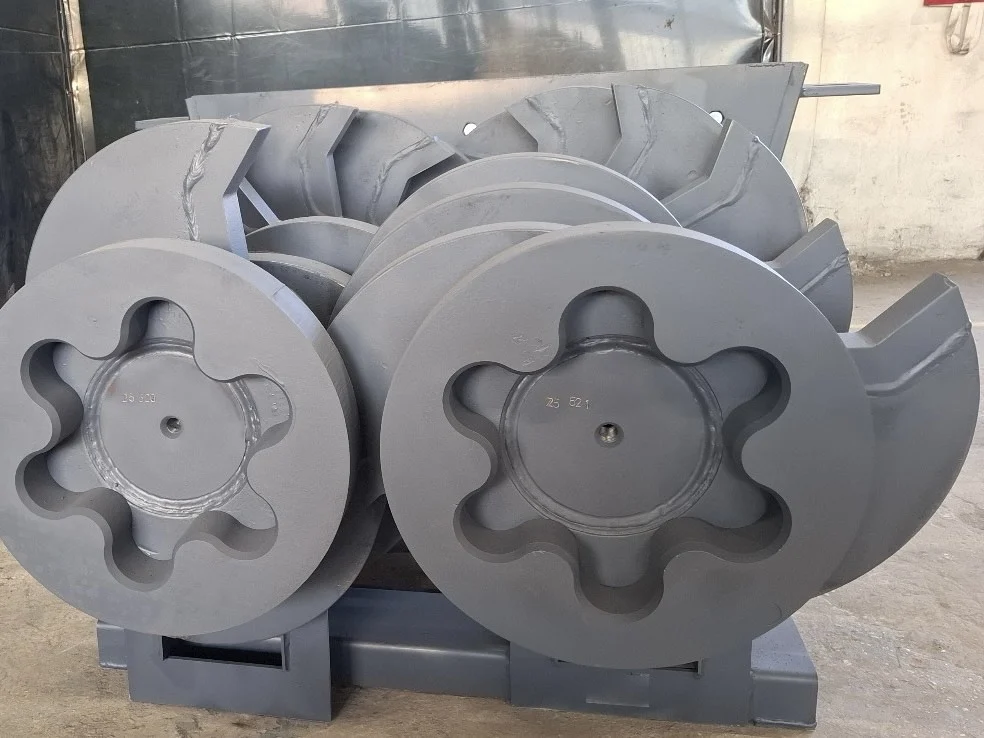 Close-up of Hardox 500 knife blocks on an Arjes Impaktor shredder shaft, highlighting the precision-machined, star-shaped cutting segments for concrete processing.