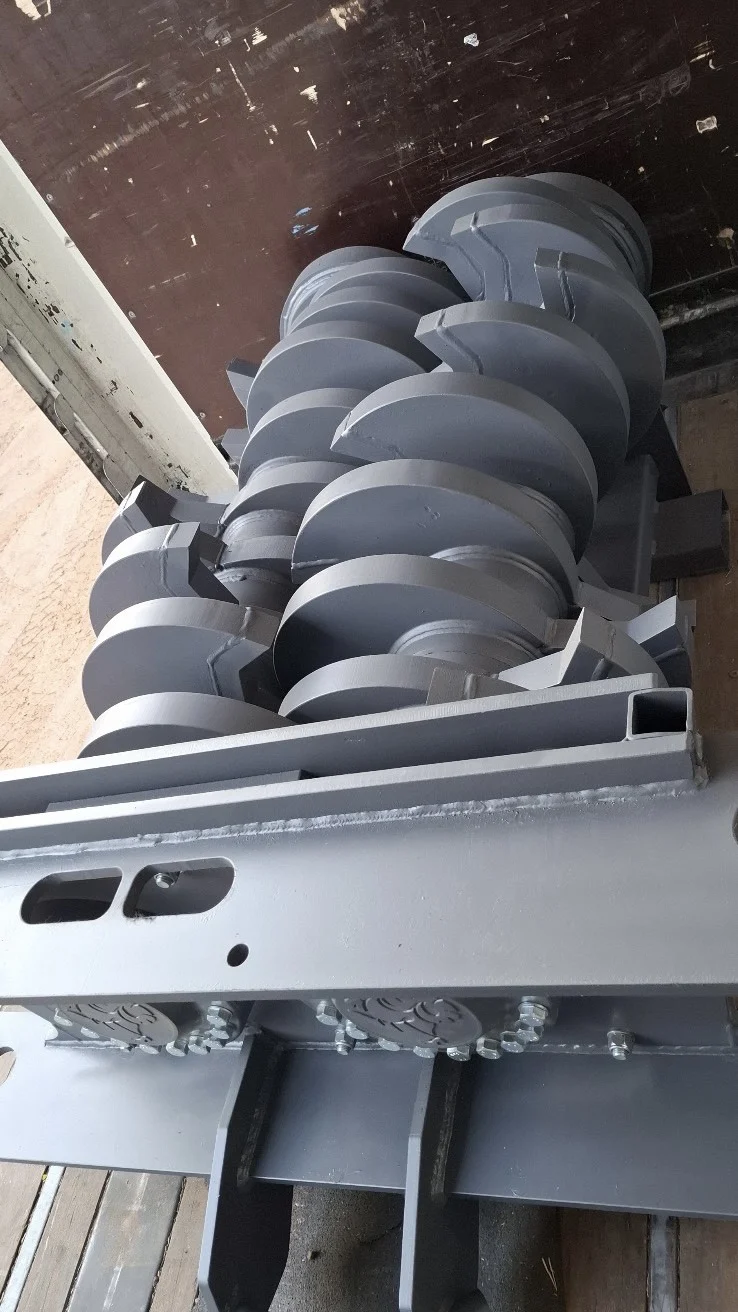 Angled side view of the complete Arjes Impaktor 250 shredder shaft set, showcasing the robust full rod construction and numerous cassette-type knife blocks.