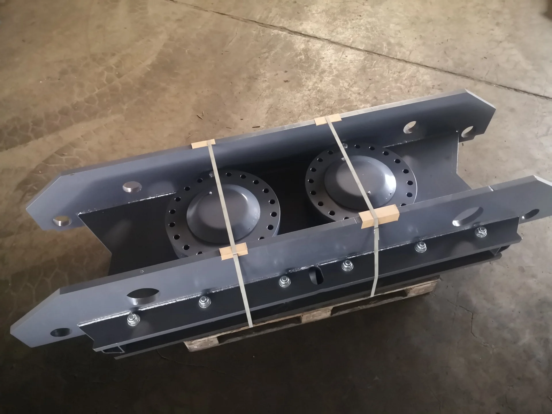 Close-up view of multiple robust metallic shredder components, likely knife blocks or wear parts, designed for heavy-duty material processing equipment.