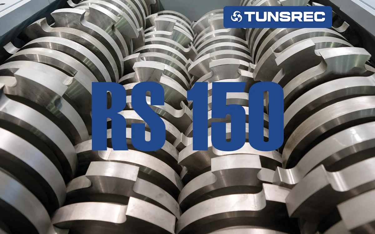 Close-up of industrial shredder knives and cutters, showcasing robust, intermeshed metallic blades designed for heavy-duty material reduction in an UNTHA RS150 four-shaft shredder.